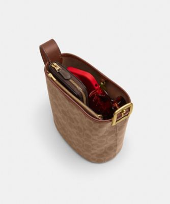 ブリーカー バケット バッグ 21・シグネチャー キャンバス | COACH